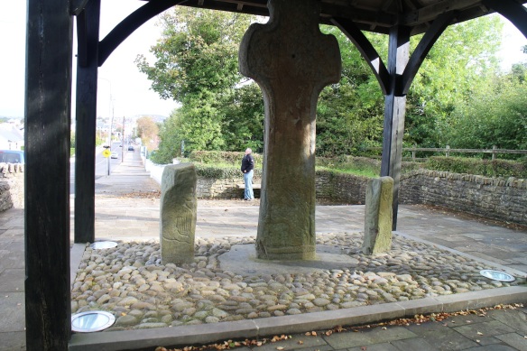 This is the other side of the Carndonagh Cross, flanked by the two pillar stones, with Gerry in the background. You can see in the pillar stones, how the artist would simply use unshaped (or barely shaped) stone, upon which he’d scratch out a drawing. That’s King David with his harp on the left.
